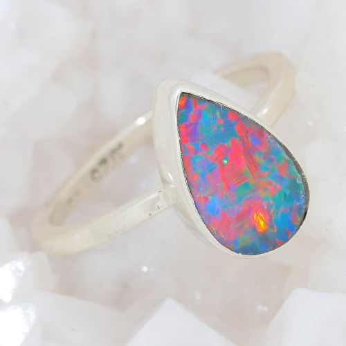   * A RAINBOW FILLED STERLING SILVER AUSTRALIAN OPAL RING